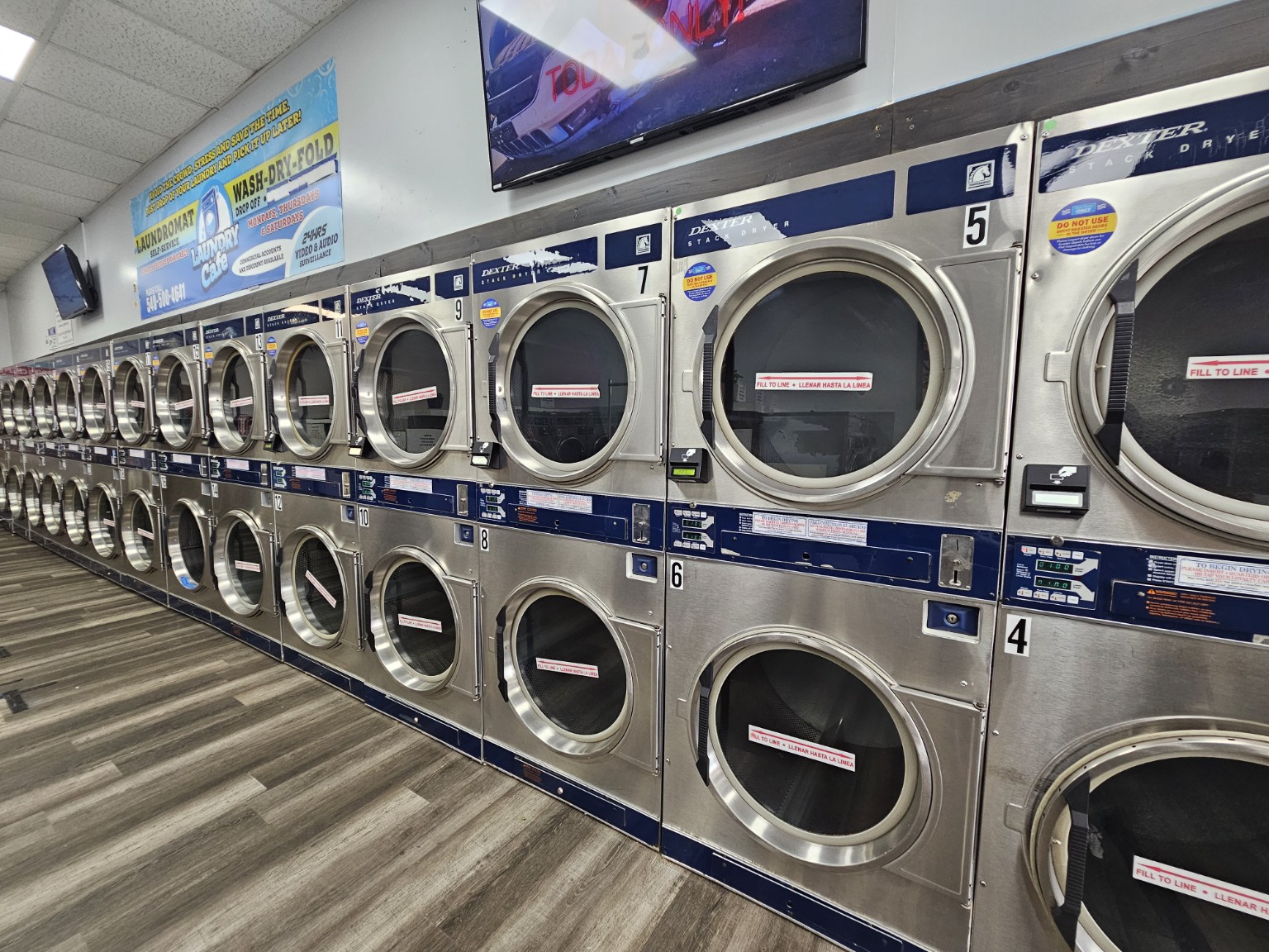 Rows of commercial dryers at Laundry Cafe
